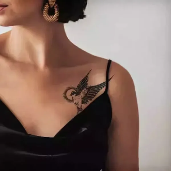 Dynamic swallow in motion temporary tattoo design with dotted halo effect