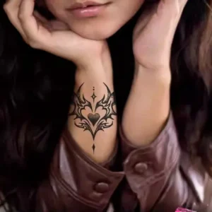 Intricate temporary tattoo featuring heart and wing motif_55_11zon